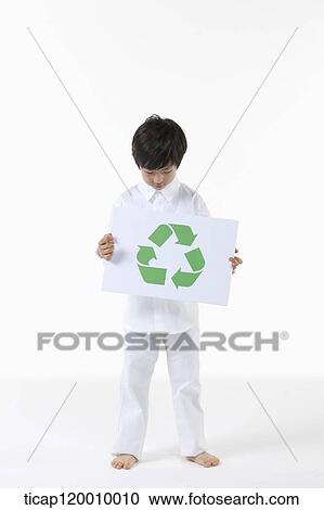 A boy looking down on recycling symbol View Large Photo Image Stock Image - A boy looking down on recycling symbol . Fotosearch