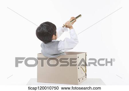 A boy looking through the telescope in the box View Large Photo Image Stock Image - A boy looking through the telescope in the box. Fotosearch
