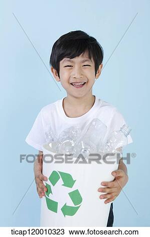 A boy smiling with recycling bin View Large Photo Image Stock Image - A boy smiling with recycling bin . Fotosearch
