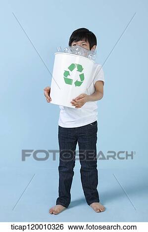 A boy smiling with recycling bin View Large Photo Image Stock Photograph - A boy smiling with recycling bin . Fotosearch