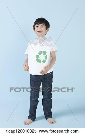 A boy smiling with recycling bin View Large Photo Image Stock Photography - A boy smiling with recycling bin . Fotosearch