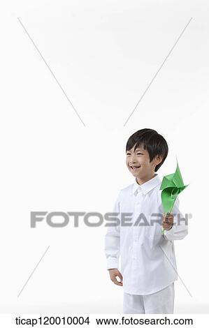 A boy with green pinwheel View Large Photo Image Picture - A boy with green pinwheel. Fotosearch
