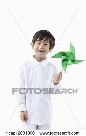 A boy with green pinwheel View Large Photo Image Stock Image - A boy with green pinwheel. Fotosearch