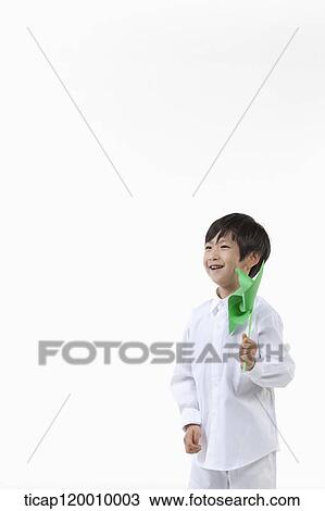 A boy with green pinwheel View Large Photo Image Stock Image - A boy with green pinwheel. Fotosearch