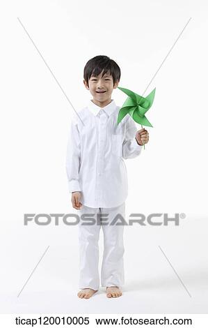 A boy with green pinwheel View Large Photo Image Stock Photography - A boy with green pinwheel. Fotosearch