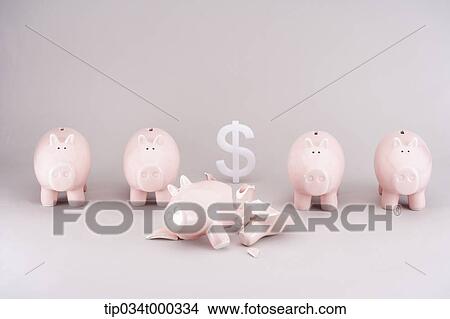Picture - A broken piggy bank and the dollar. Fotosearch