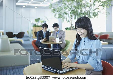 A business woman typing on the laptop View Large Photo Image Stock Photo - A business woman typing on the laptop . Fotosearch