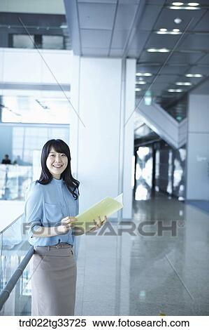 A business woman with the document file View Large Photo Image Stock Photography - A business woman with the document file. Fotosearch