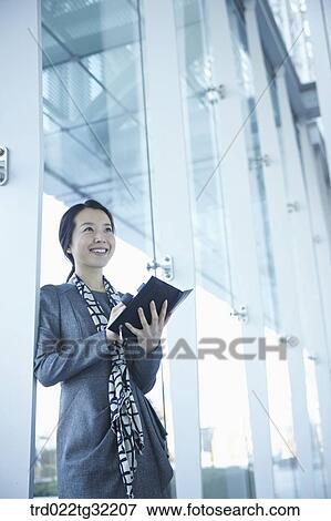 A business woman with the planner View Large Photo Image Stock Photo - A business woman with the planner. Fotosearch