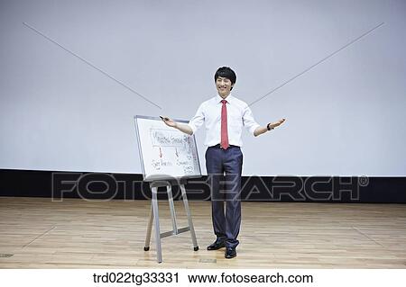 A businessman having presentation with a white board View Large Photo Image Stock Image - A businessman having presentation with a white board. Fotosearch