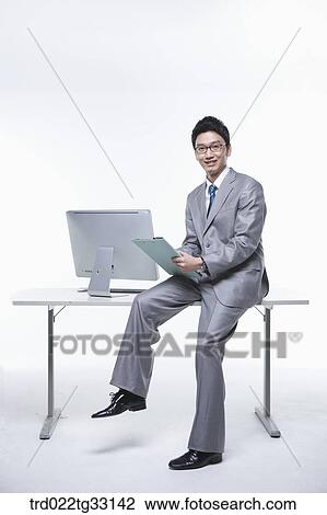 A businessman holding the document View Large Photo Image Stock Image - A businessman holding the document . Fotosearch