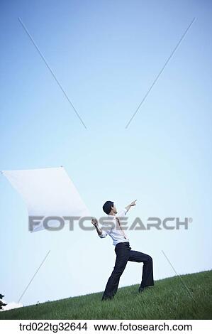 A businessman holding the white flag View Large Photo Image Picture - A businessman holding the white flag. Fotosearch