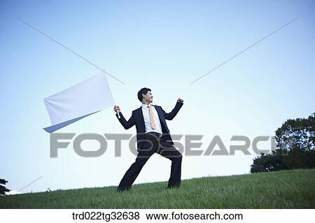 A businessman holding the white flag View Large Photo Image Stock Photo - A businessman holding the white flag. Fotosearch