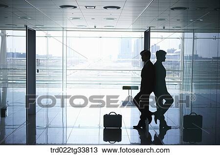 A businessman leaning on the wall View Large Photo Image Stock Image - A businessman leaning on the wall. Fotosearch