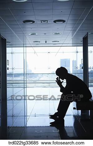 A businessman sitting in the hallway View Large Photo Image Stock Photography - A businessman sitting in the hallway. Fotosearch