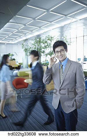 A businessman talking on the mobile View Large Photo Image Stock Photo - A businessman talking on the mobile. Fotosearch
