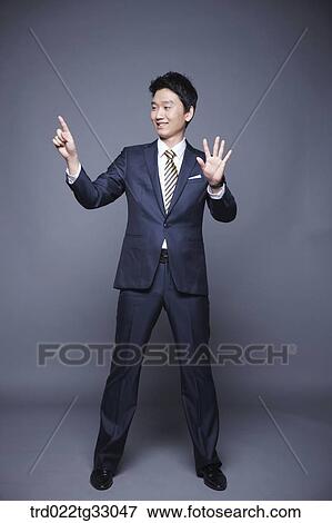 A businessman touching on the something View Large Photo Image Stock Photo - A businessman touching on the something. Fotosearch