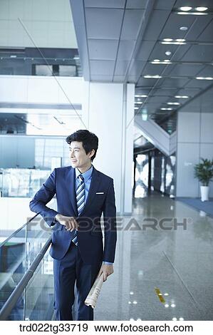 A businessman with the newspaper View Large Photo Image Stock Photo - A businessman with the newspaper. Fotosearch