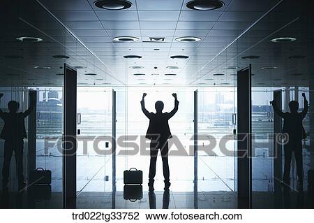 A cheerful businessman in the hallway View Large Photo Image Stock Image - A cheerful businessman in the hallway. Fotosearch