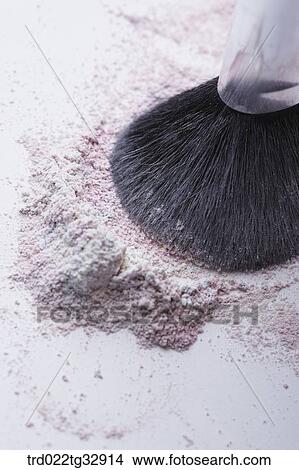 Picture - A cosmetic brush with colorful powder. Fotosearch
