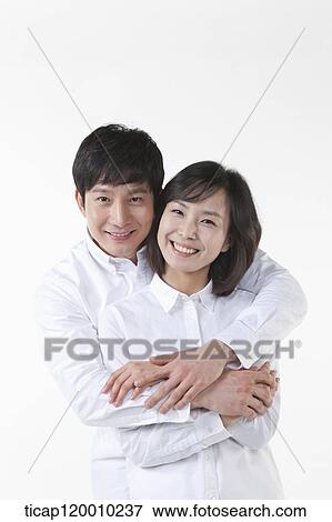 A couple hugging together View Large Photo Image Stock Photo - A couple hugging together. Fotosearch
