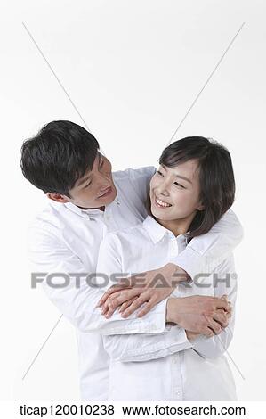 A couple looking at each other View Large Photo Image Stock Photo - A couple looking at each other. Fotosearch