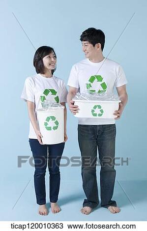 A couple smiling with recycling bin View Large Photo Image Stock Image - A couple smiling with recycling bin . Fotosearch
