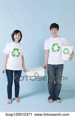 A couple smiling with recycling bin View Large Photo Image Stock Image - A couple smiling with recycling bin . Fotosearch