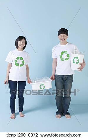 A couple smiling with recycling bin View Large Photo Image Stock Image - A couple smiling with recycling bin . Fotosearch