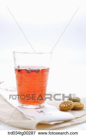 Stock Photo - A cup of drink and Korean dessert . Fotosearch