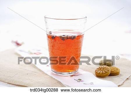 Stock Photo - A cup of drink and Korean dessert . Fotosearch