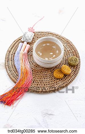A cup of drink, colorful dessert, and traditional clothes accessory View Large Photo Image Stock Photography - A cup of drink, colorful dessert, and traditional clothes accessory . Fotosearch