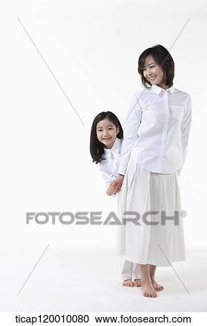 A daughter behind her mother View Large Photo Image Stock Image - A daughter behind her mother . Fotosearch