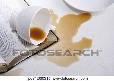 A fallen cup of coffee on the book View Large Photo Image Stock Photography - A fallen cup of coffee on the book. Fotosearch
