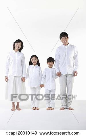 Stock Photo - A family holding hands together. Fotosearch