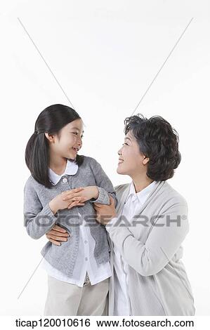 A family holding hands together View Large Photo Image Stock Photograph - A family holding hands together. Fotosearch
