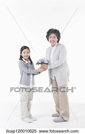 Stock Photography - A family holding hands together. Fotosearch