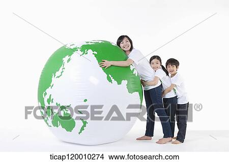 Picture - A family hugging a green globe. Fotosearch