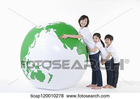 A family hugging a green globe View Large Photo Image Stock Photo - A family hugging a green globe. Fotosearch