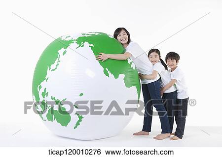 Stock Photograph - A family hugging a green globe. Fotosearch