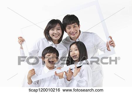 A family in the white frame View Large Photo Image Stock Photograph - A family in the white frame. Fotosearch