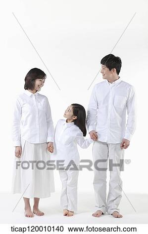 Stock Image - A family looking at each other. Fotosearch
