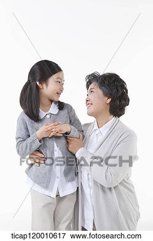 Stock Photo - A family looking at each other. Fotosearch