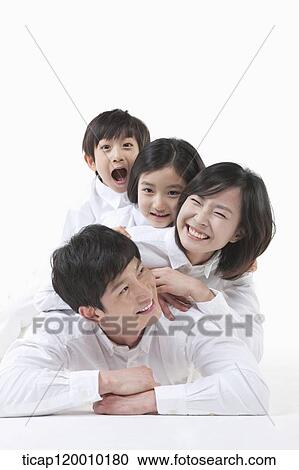 Stock Image - A family resting on each other. Fotosearch
