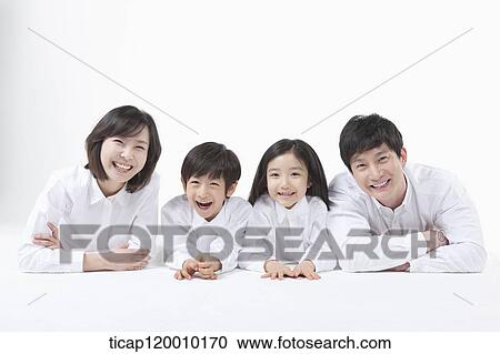 Stock Image - A family resting on the table. Fotosearch