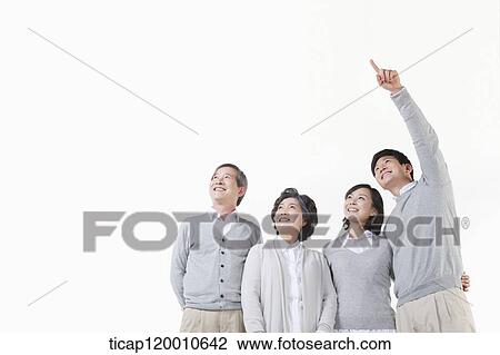 Stock Image - A family resting on the table. Fotosearch