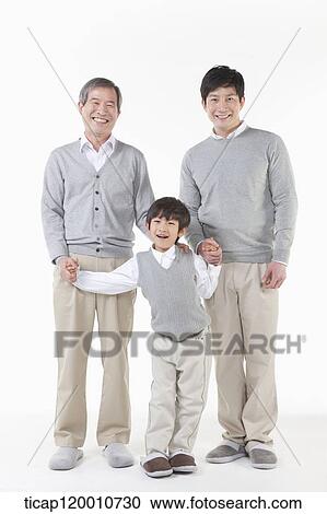 A family sitting on the couch View Large Photo Image Stock Image - A family sitting on the couch. Fotosearch