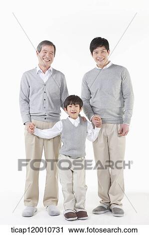 A family sitting on the couch View Large Photo Image Stock Image - A family sitting on the couch. Fotosearch