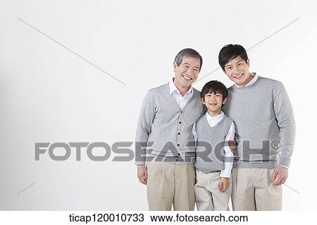 A family sitting on the couch View Large Photo Image Stock Image - A family sitting on the couch. Fotosearch