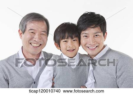 A family sitting on the couch View Large Photo Image Stock Image - A family sitting on the couch. Fotosearch